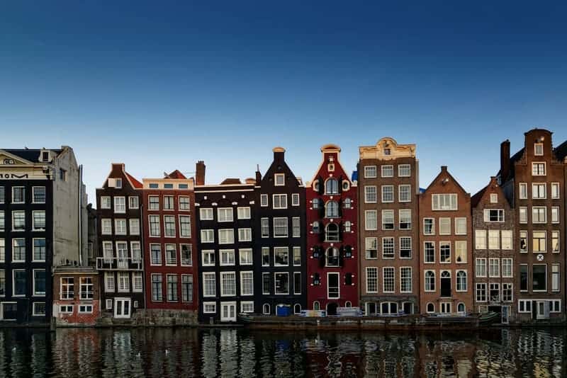 A row of brick canal houses in the evening light