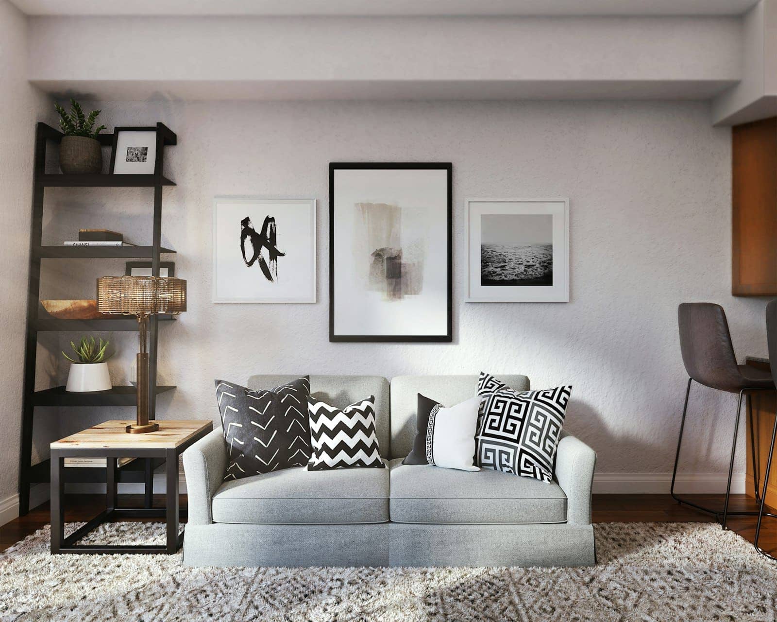 A light living room with framed prints above a sofa